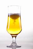 Glass of beer on a white background