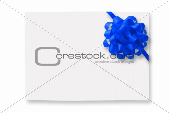 Blank gift tag tied with a bow of blue satin ribbon.