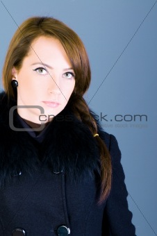 Portrait of a young woman wearing coat