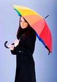Portrait of young woman with umbrella