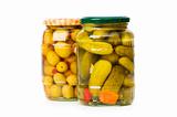 Pickled cucumbers and olives in glass jar