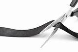 Scissors cutting black ribbon 