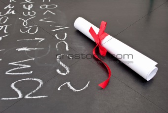 Chalkboard with a diploma 