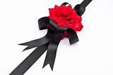 Red rose with black ribbon 