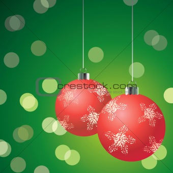 Red christmas balls on the green background