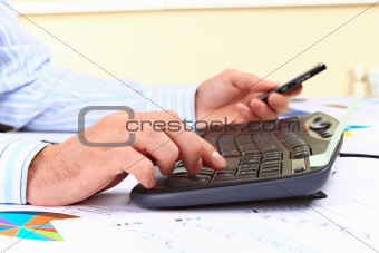 Young man working on computer at office