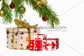 Boxes with gifts under a christmas fur-tree