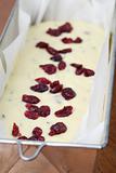 Making zucchini bread with cranberries