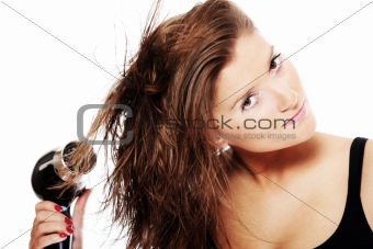 Young woman drying hair
