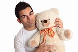 Affectionate man holding bear