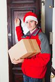 Delivery Boy with Christmas Hat Knock at the Door