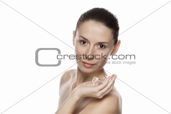 Portrait of young beautiful girl holding ice cubes