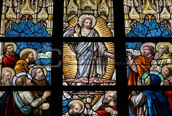 Leaded glass window in church of Alsemberg (close to Brussels in Belgium), made in 1895. Depiction of resurrected Jesus and the apostles (Pentecost).