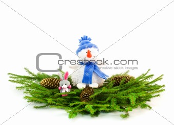 Christmas tree branches with snowman and rabbit