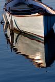 Morning light on a grey boat 
