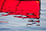 Red reflections on the water