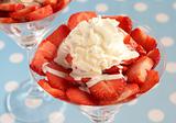 Strawberries with cream in glasses