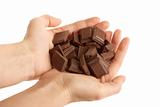 Hands holding blocks of Chocolate