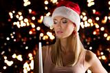 girl santa claus with candle