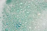 soap foam on blue water