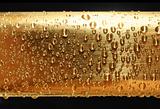 water drops on golden metal