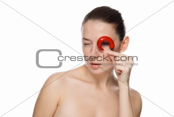 Portrait of young beautiful girl with chili pepper