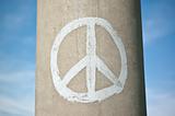 Peace Sign on a Concrete Pillar with Blue Sky