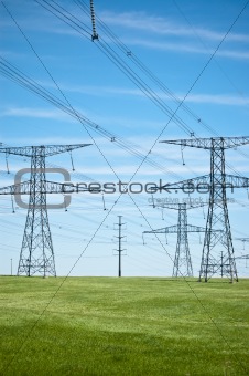 Power Lines with Blue Sky and Green Grass