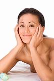 Topless ethnic friendly smiling woman in lying in spa