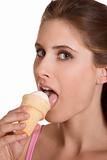 Young woman eating ice cream in waffle cone