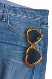 Heart Shaped Sunglasses in the Pocket of Denim Blue Jean Pants