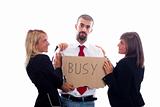 Businessman Hold Busy Sign with Two Businesswoman Flirting