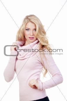beautiful young blond woman standing, looking - isolated on white