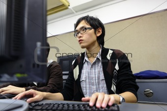 student studying in computer room