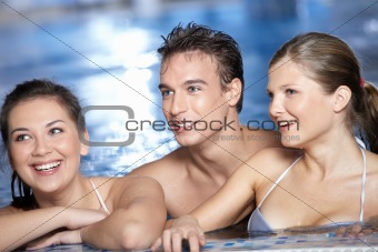 Laughing friends in pool