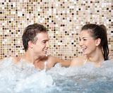 Happy couple in a jacuzzi