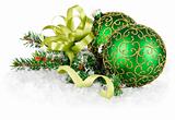 green balls in snow with gold bow