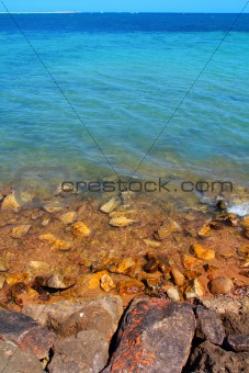 Rocky beach shore turquoise ocean sea