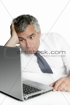 relaxed senior businessman looking computer