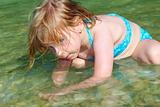 blond girl swimming in lake river