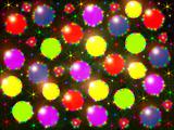 Many-coloured christmas balls with colour light