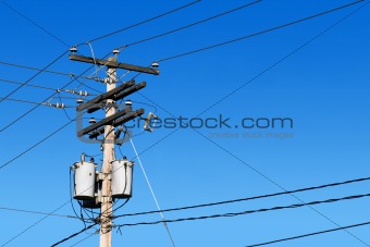 Power line post and blue sky