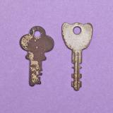 Set of Vintage Keys on a Purple Background.
