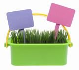 Basket of Grass with Two Blank Garden Stakes