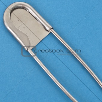 Close Up of Large Safety Pin on a Vibrant Background