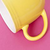 Yellow Coffee Cup on a Vibrant Background