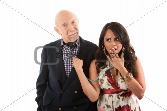Rich elderly man with gold-digger companion or wife