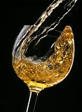 white wine being poured into glass