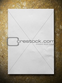 White blank paper on Gold stone