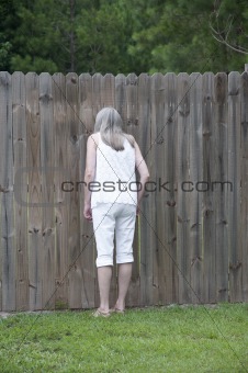 Woman Looking Through Peephole